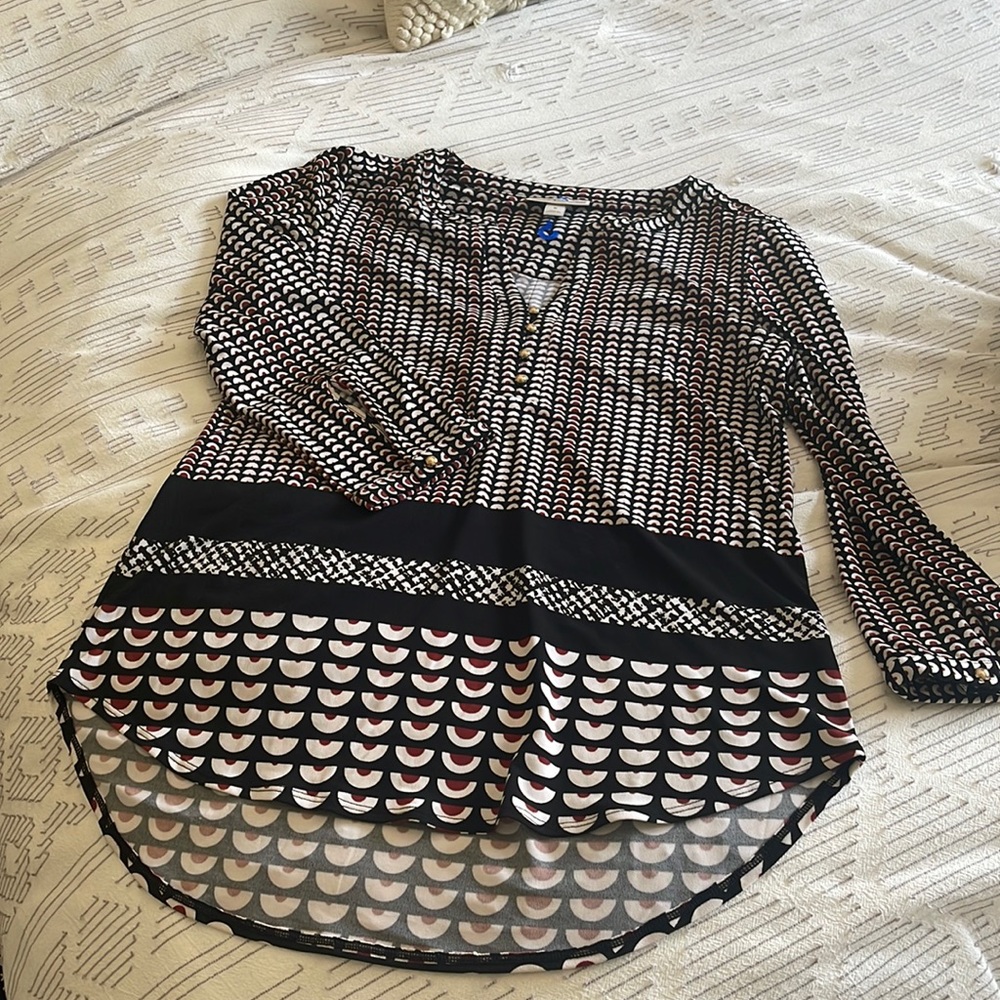 Three quarter length sleeved dressy top with gold buttons